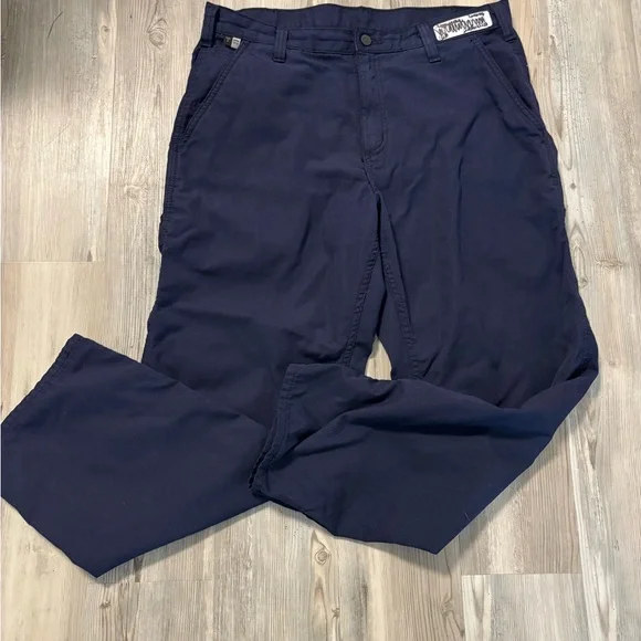 Durable Carhartt FR flame-resistant work pants in navy. Size 34x30.